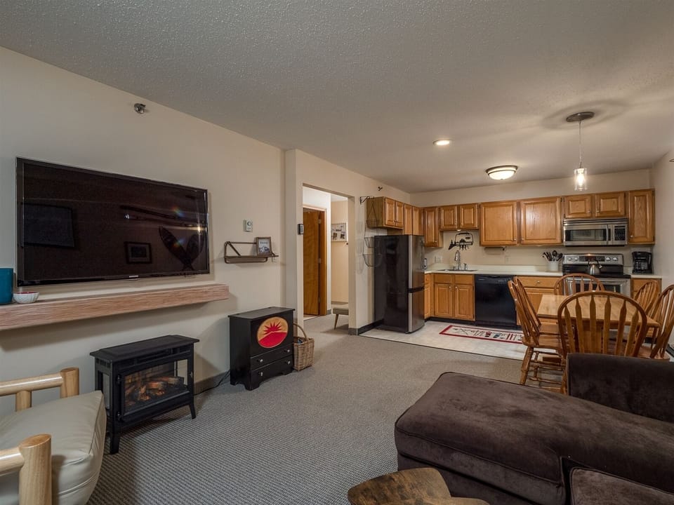 View of living, dining, and kitchen area