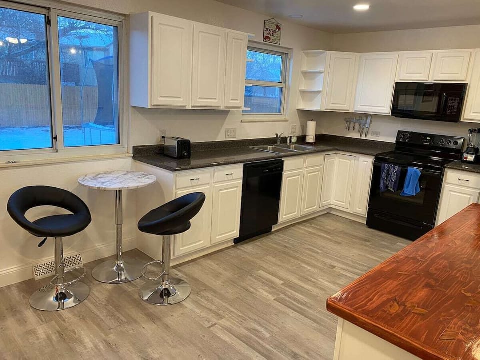 Well stocked kitchen with full size fridge makes meal prep a breeze. 