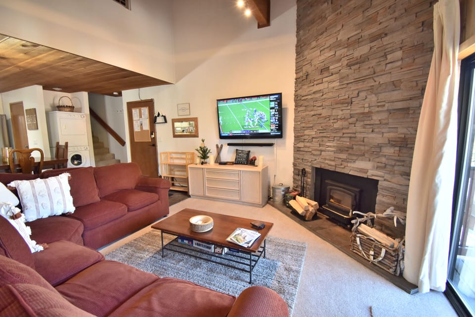 Enjoy the wood burning fire place and 75 inch smart TV with Samsung sound system