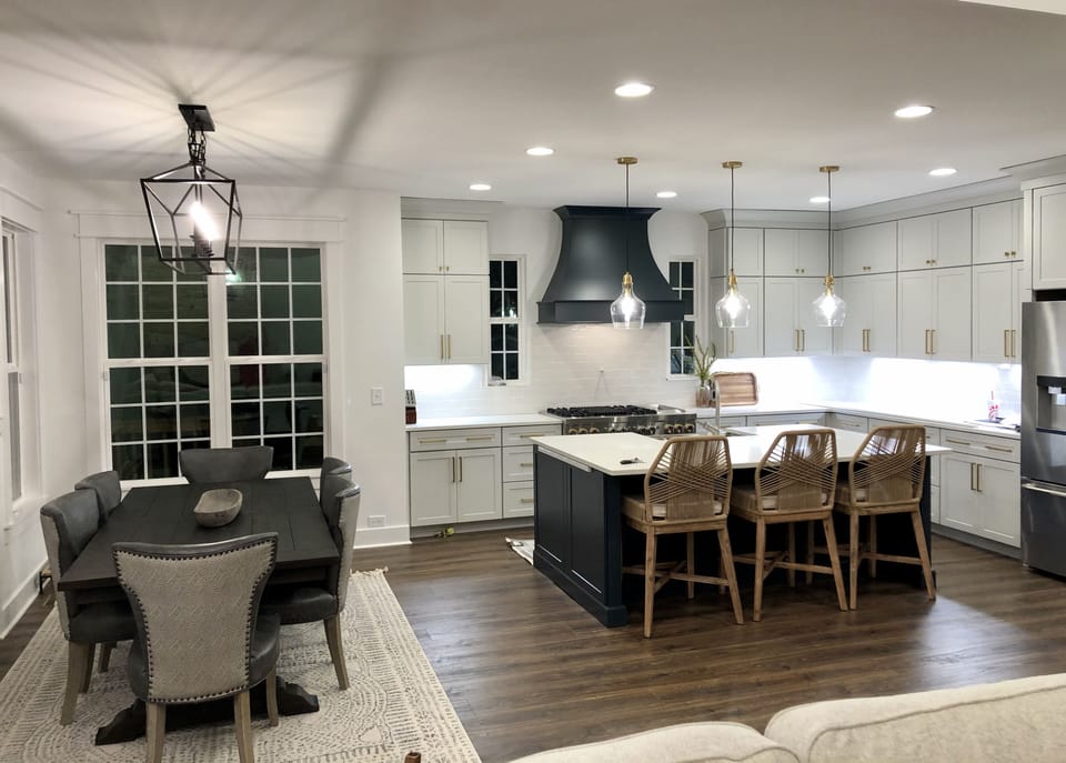 Gourmet kitchen with a double oven range with 4 burners and a griddle. 