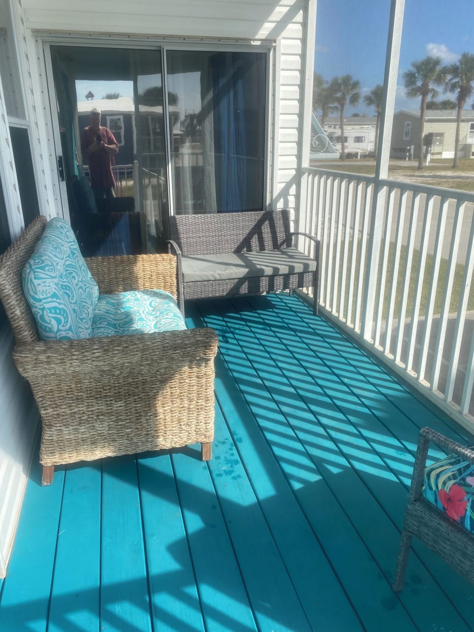 Screened in sitting area front of house