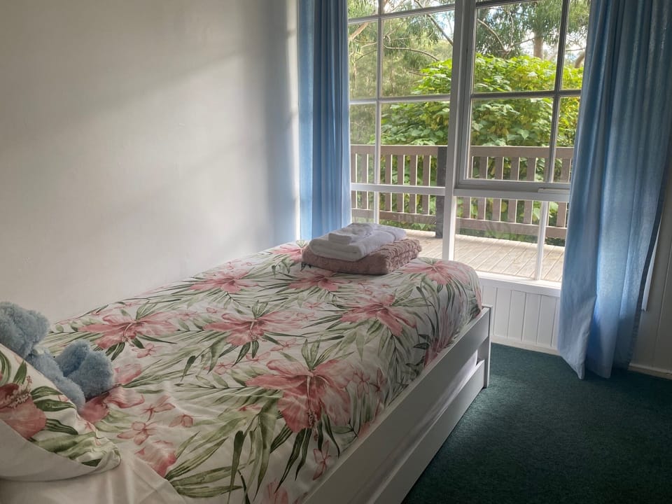 Bedroom Three with single bed and trundle bed