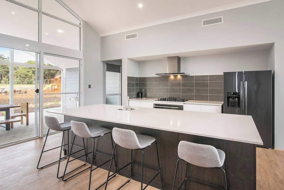 Whip up a feast in the spacious kitchen, complete with modern appliances, ample counter space, and a butler’s pantry to make cooking a breeze.