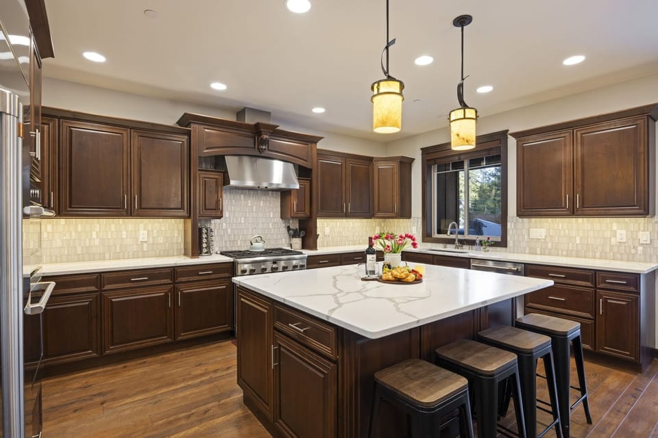 Cook up memories in the fully equipped gourmet kitchen with marble island and premium appliances.
