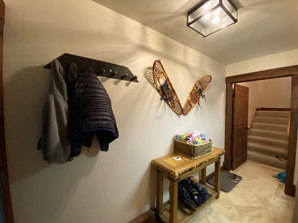 Entrance with coat rack. 