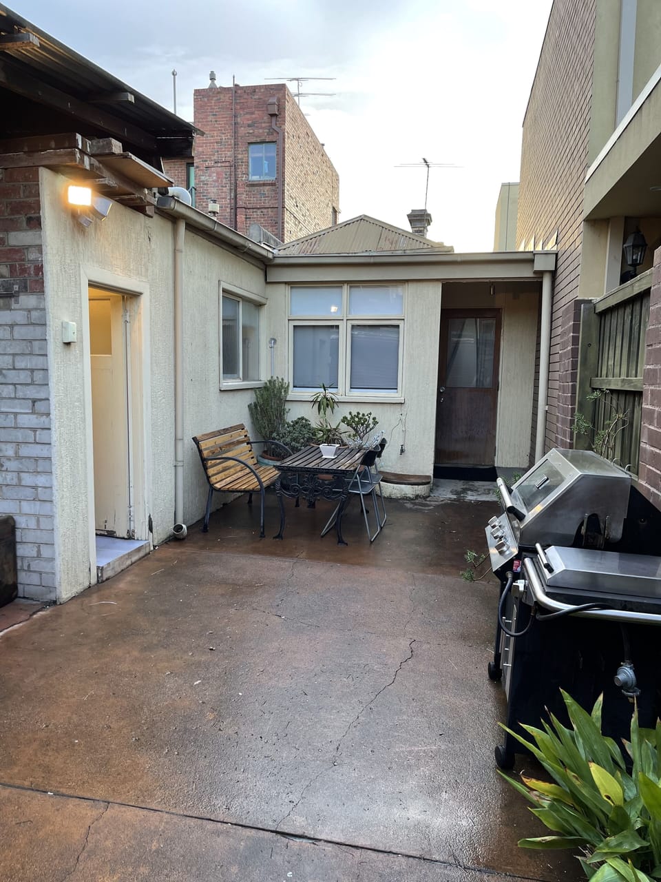 Rear garden with BBQ, setting, outside toilet and remote control roller 