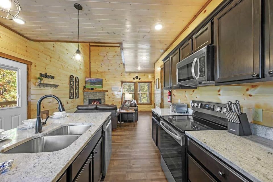 Modern state of the art Fully functioning Kitchen and large granite countertop with seats