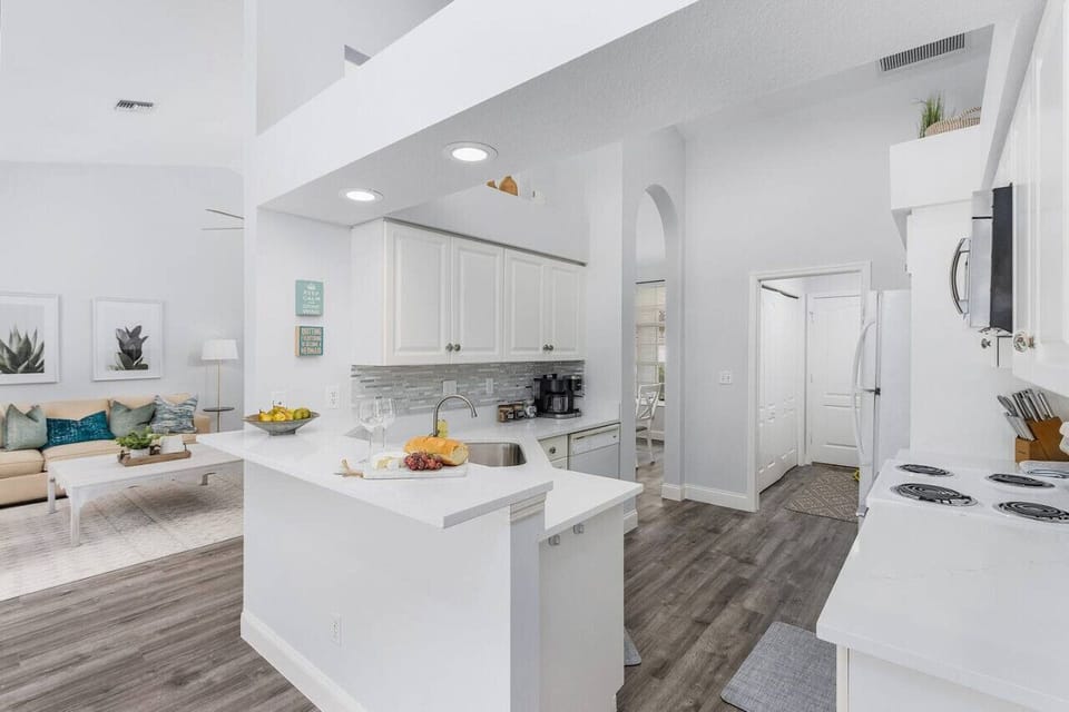 Fully equipped kitchen with clean lines and bright cooking area