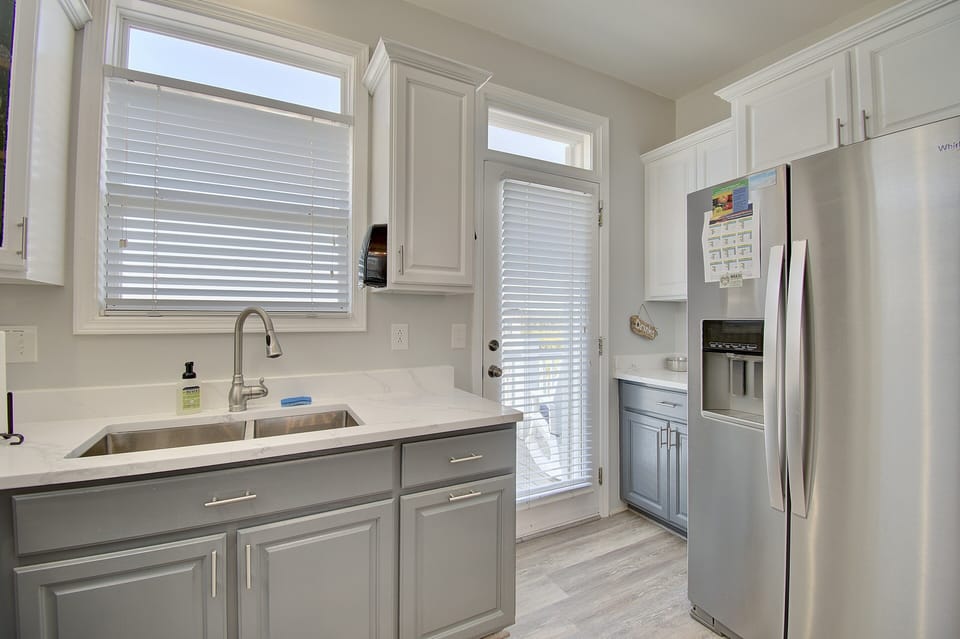 A doorway from the kitchen leads to a deck overlooking the inlet.