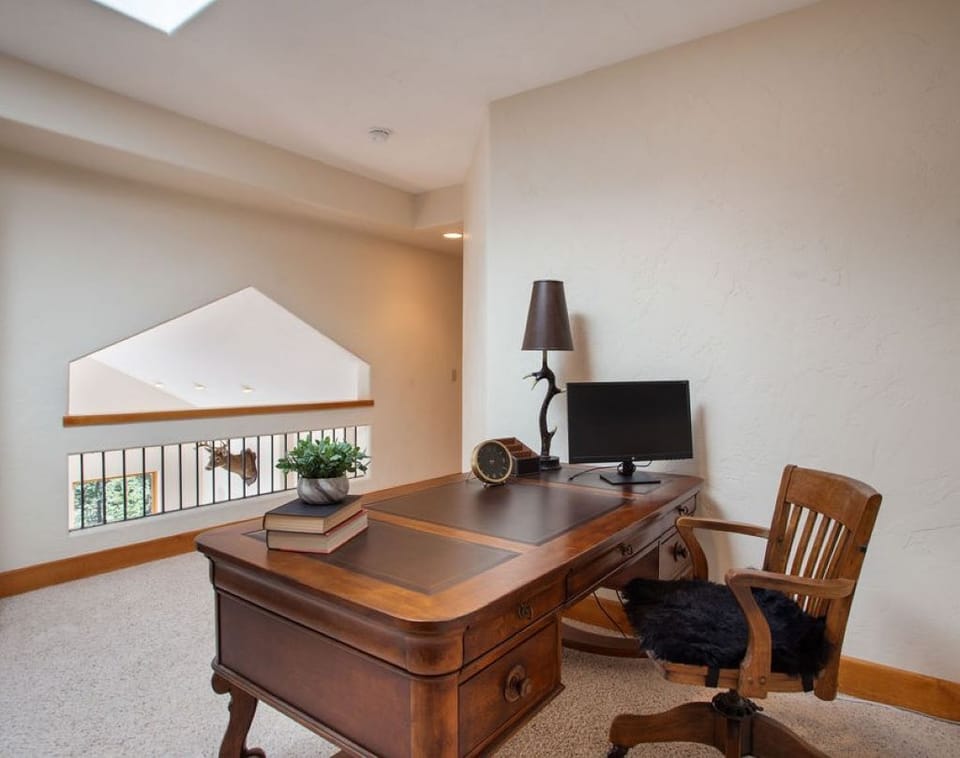 Loft area with executive desk outside Master Suite.