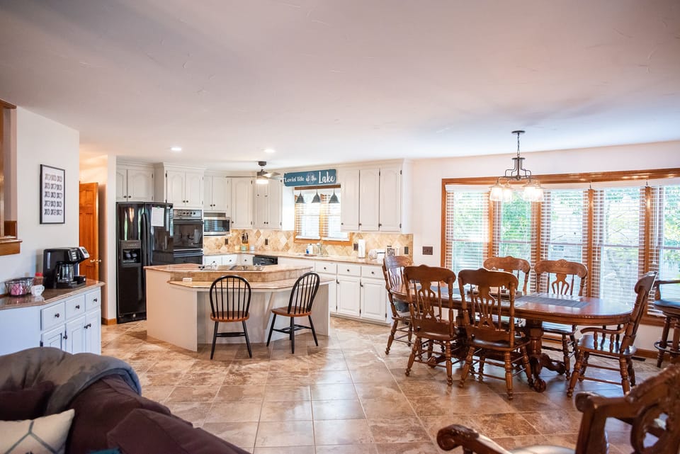Dining area adjacent to kitchen and sun room
