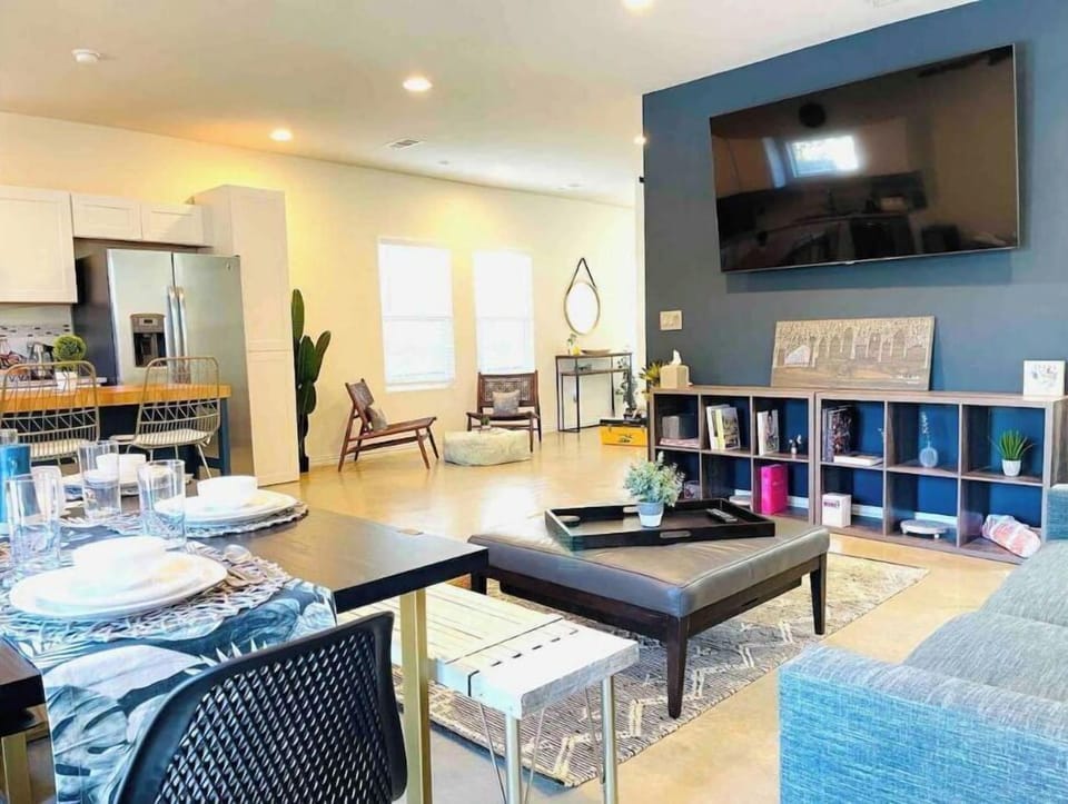 Enjoy the living/dining area with a 75” Smart TV, board games, and local art.