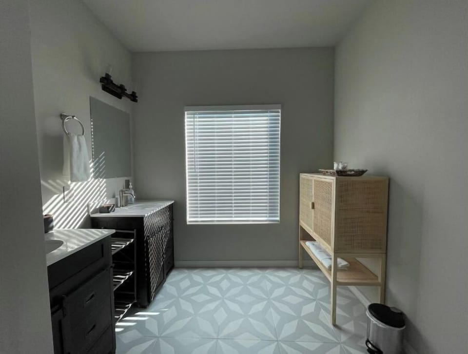 Master ensuite bathroom with double vanity.
