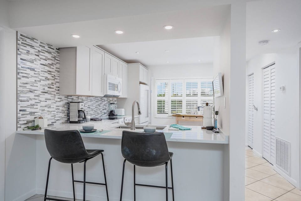 Both a dining table plus a kitchen counter bar for two.