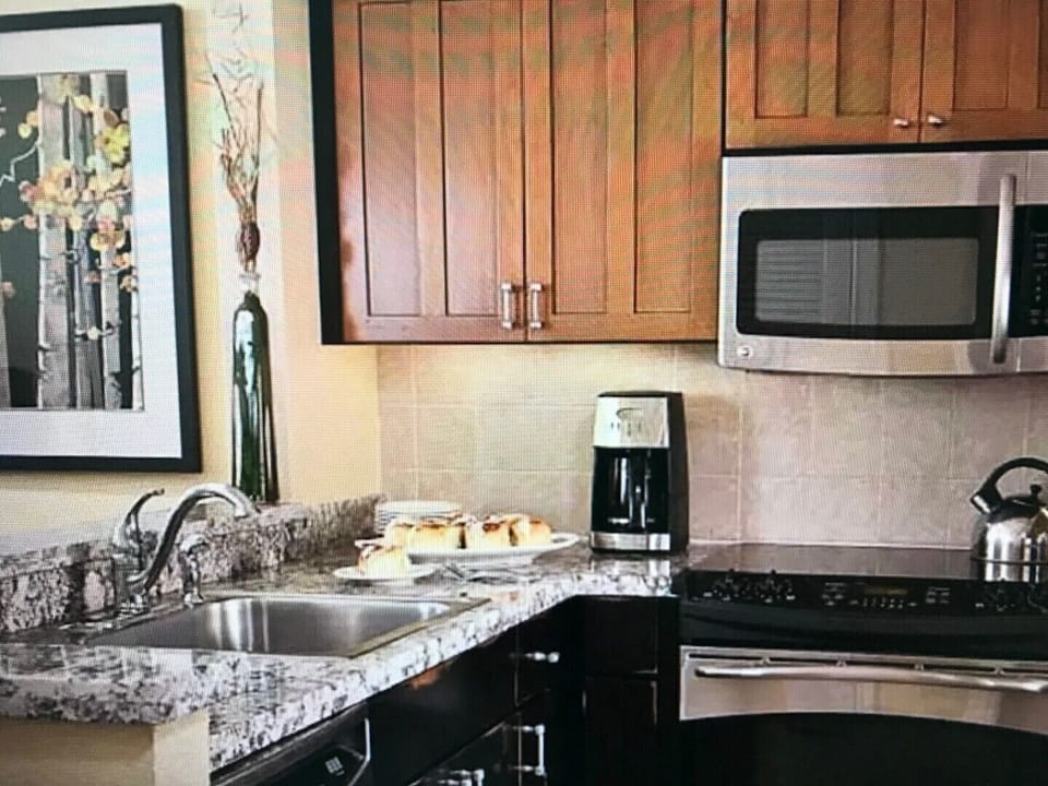 Updated kitchen with stainless steel appliances.