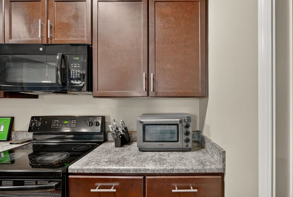 Extra countertop appliances and well-stocked essentials for convenient home-cooked meals.
