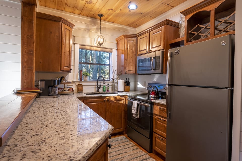 Kitchen stocked with pots, pans, and utensils 