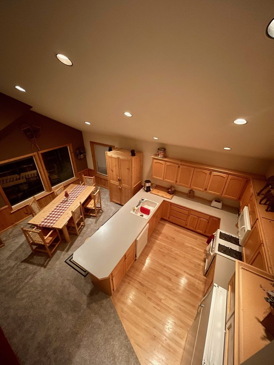 View of kitchen and dining areas from loft






