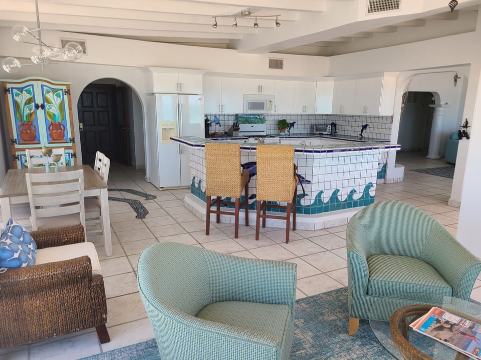 Lounge area, dining room, kitchen.
This hallway leads to guest bedroom & bath