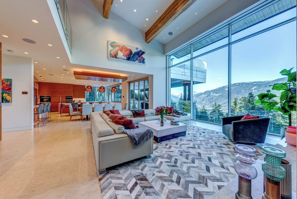 Large open concept living room with amazing valley views and gas fireplace