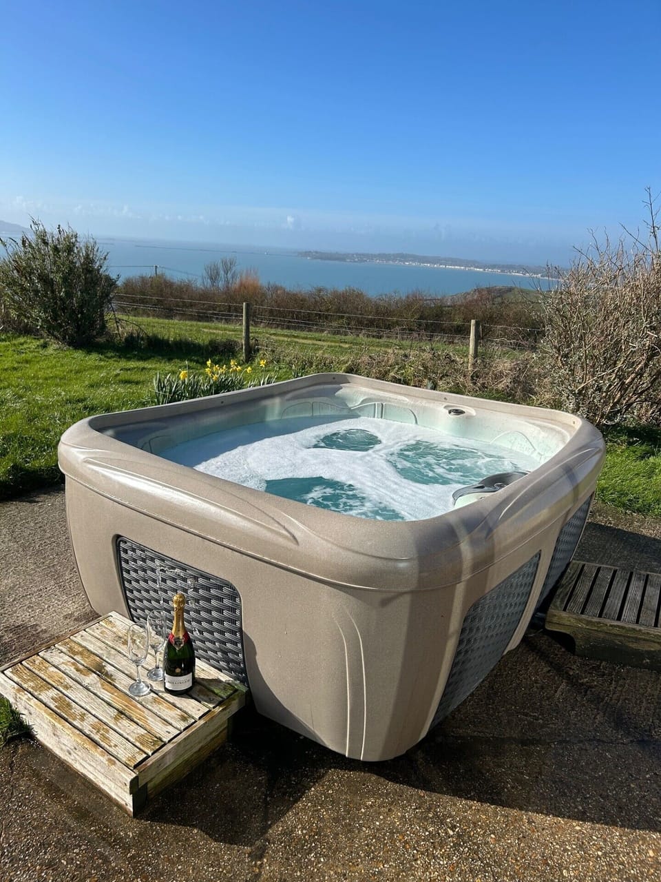 Outdoor hot tub with sea views 
