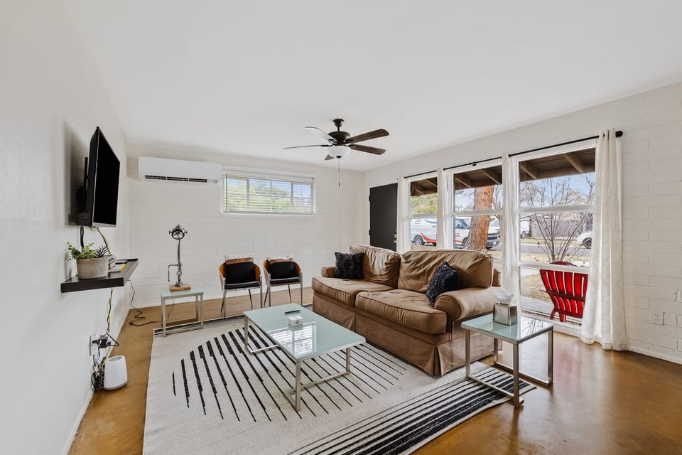 Hang out and socialize in this modern living room equipped with a 43" TV, sleeper sofa and chairs!