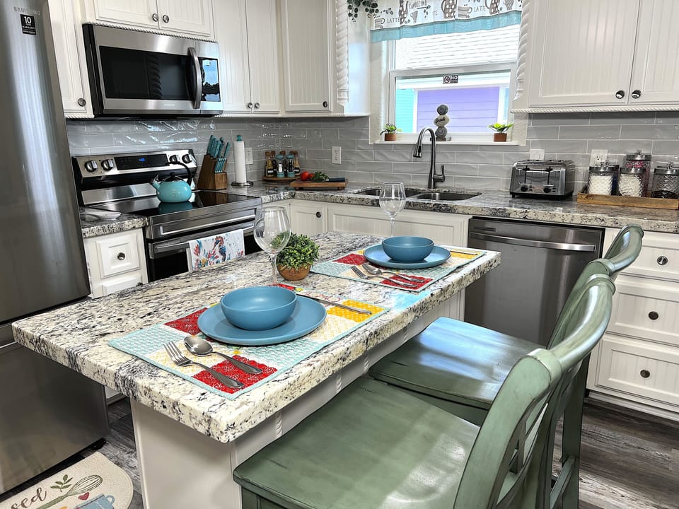 Fully equipped kitchen with all utensils and condiments, oils, and supplies