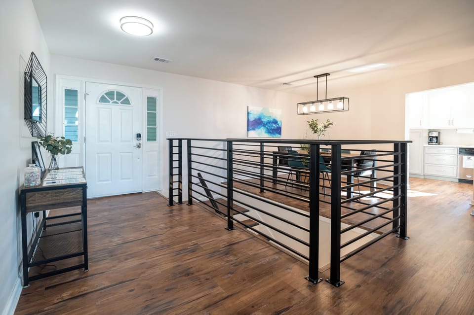 Front entry, dining room and stairs leading to walk out basement