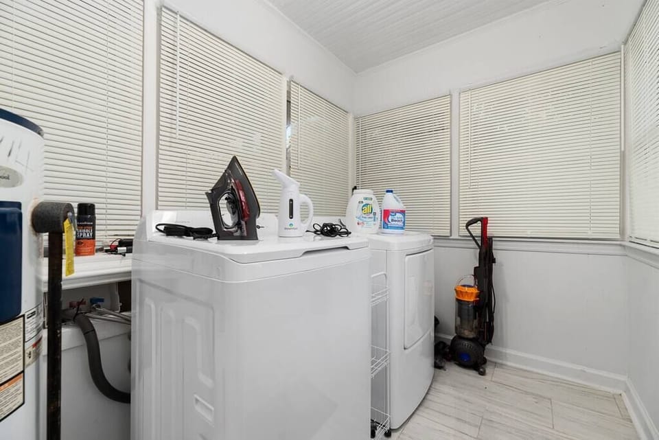 Laundry room with free washer, dryer, sensitive skin Free & Clear laundry detergent, iron, ironing board, steamer, vacuum cleaner, mop, bleach and more. 