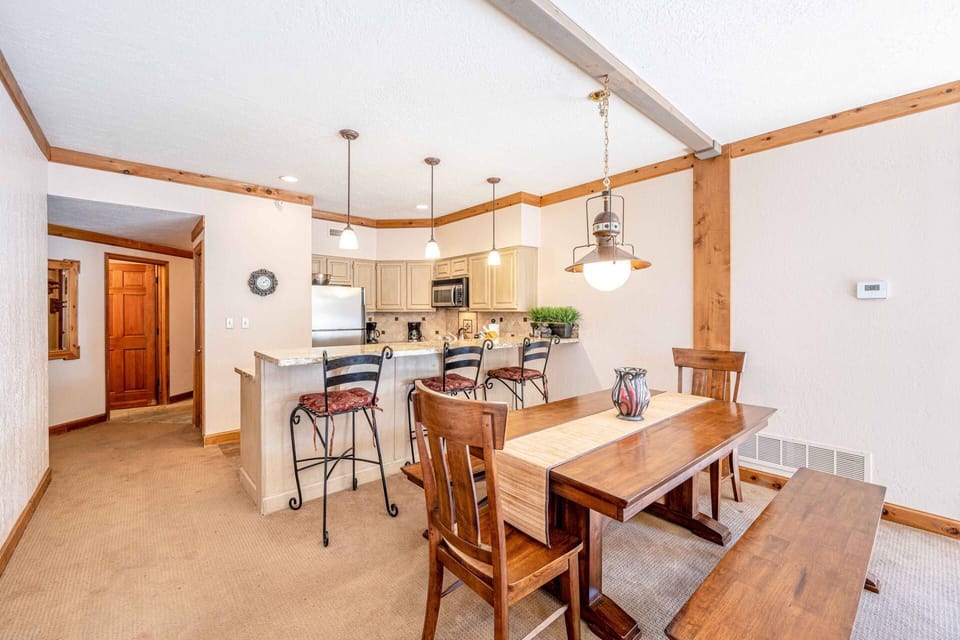 Deer Valley ski in ski out. The warm and inviting main living area has an open concept floor plan flows seamless from the kitchen to the dining room t