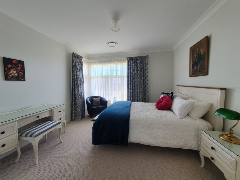 Spacious bedroom (Queen bed) with built in robes for a longer stay.