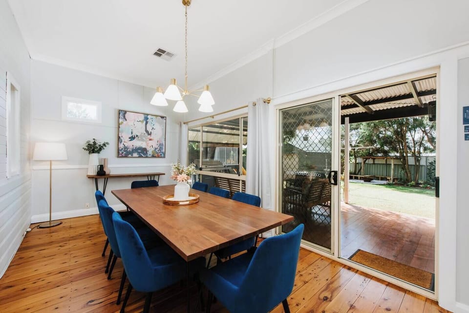 Sliding doors open from the dining area to the back deck and yard.