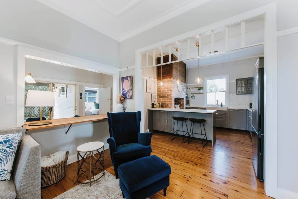 The living area seamlessly extends to the kitchen and dining areas.