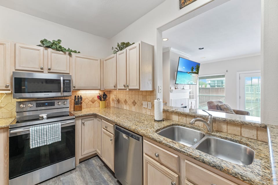 Your fully-equipped kitchen features granite countertops, stainless steel appliances, and everything you need to create memorable meals during your stay.