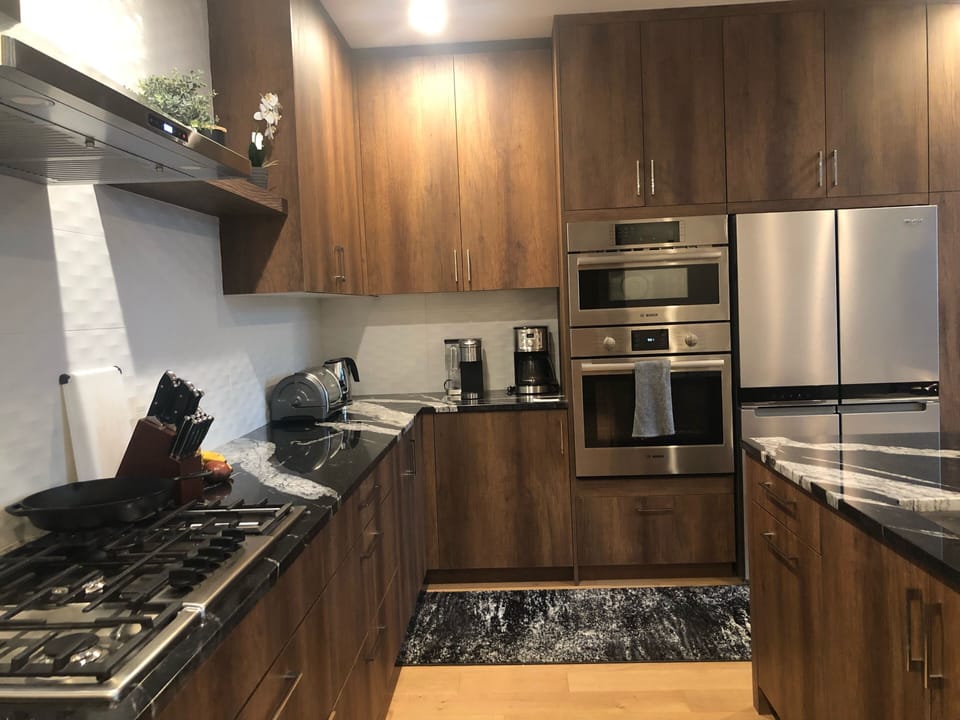 5 burner gas stove, convection microwave, and full oven.