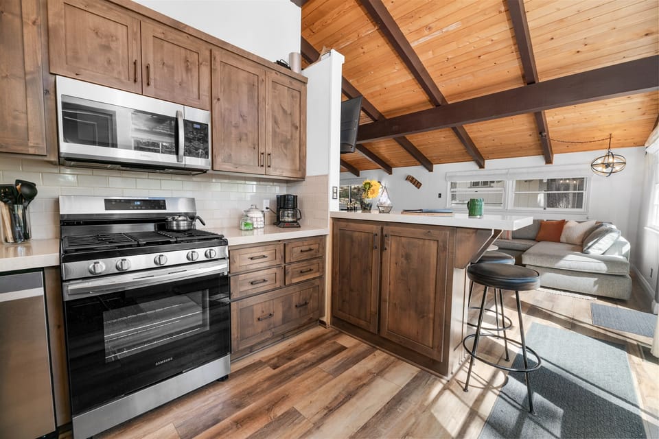 The cabin's kitchen is newly updated and fully appointed for any meal. Beyond the gas range, you'll find a crock pot, more pans that you'll know what to do with, a blender, and electric whisk. Pull out that inner chef!