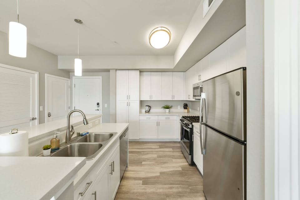 A rice cooker is stored in the kitchen cabinets