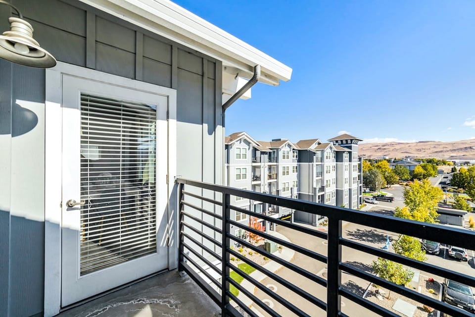 Walk out onto the private balcony for a breath of fresh air and beautiful views of the mountains