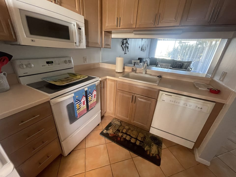 Full kitchen with updated appliances, basic cookware, and utensils
