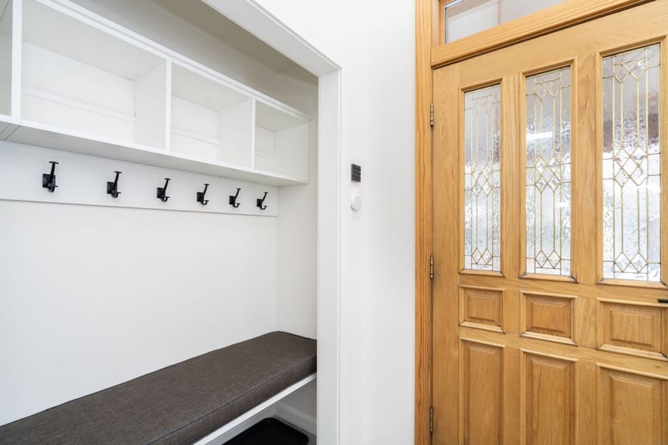 Upon entry, there's plenty of space to stash your outerwear and keep it all organized.