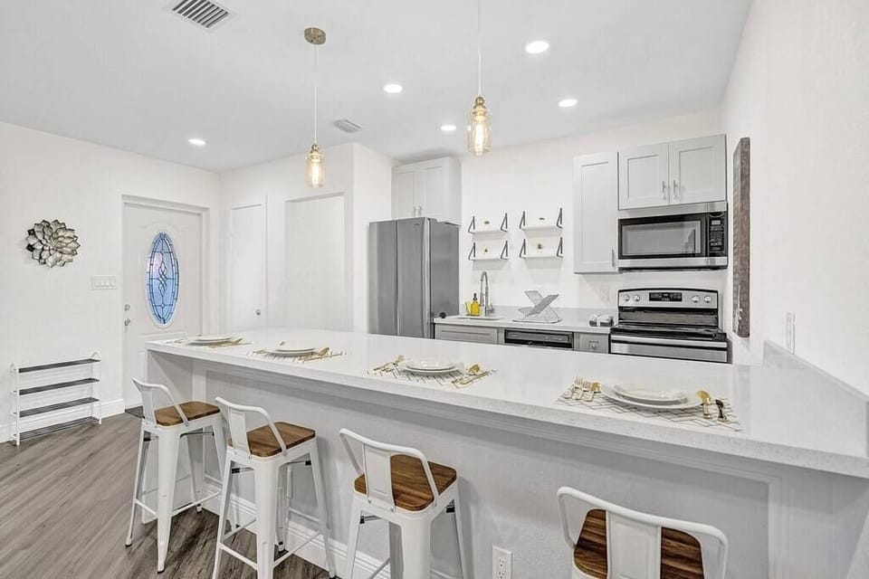 You will love the light fixtures in the kitchen. They are simple and modern. 