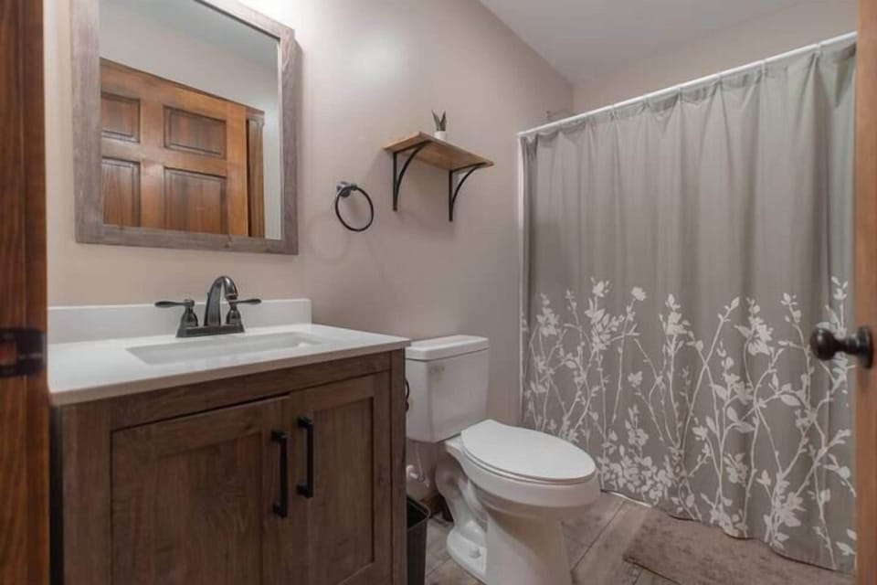 Freshen up and rejuvenate in our pristine bathroom oasis after a day of mountain adventures.