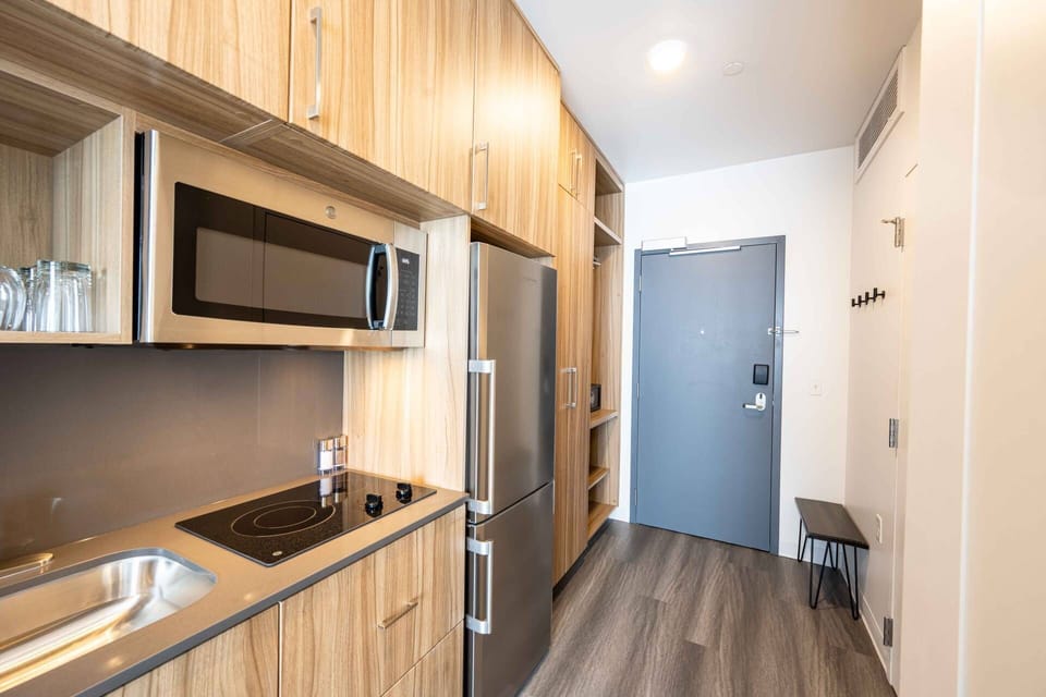 The open floorpan provides a full sized closet, lap top sized safe, and a comfy bench all in the entryway