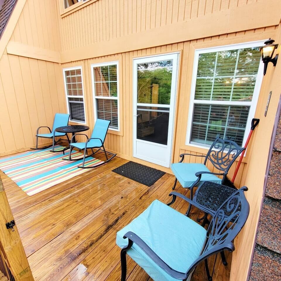Back balcony has seating and tables perfect for enjoying the fresh mountain air
