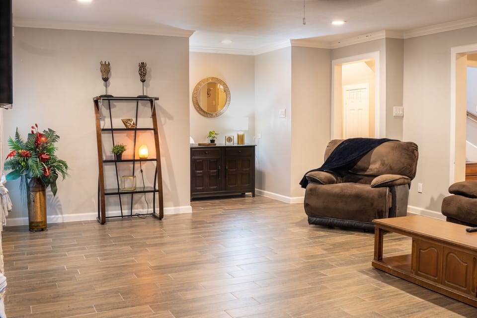Main living room with a curved smart TV
