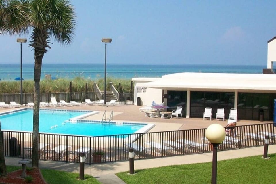Pool and pool house by beach entrance