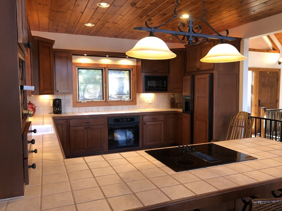 Kitchen.  Bar seats 3.