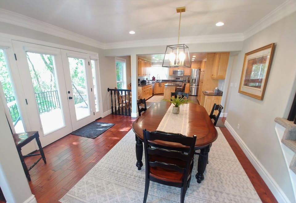 Large Dinner table with Panoramic Views off of the Main Floor Kitchen
