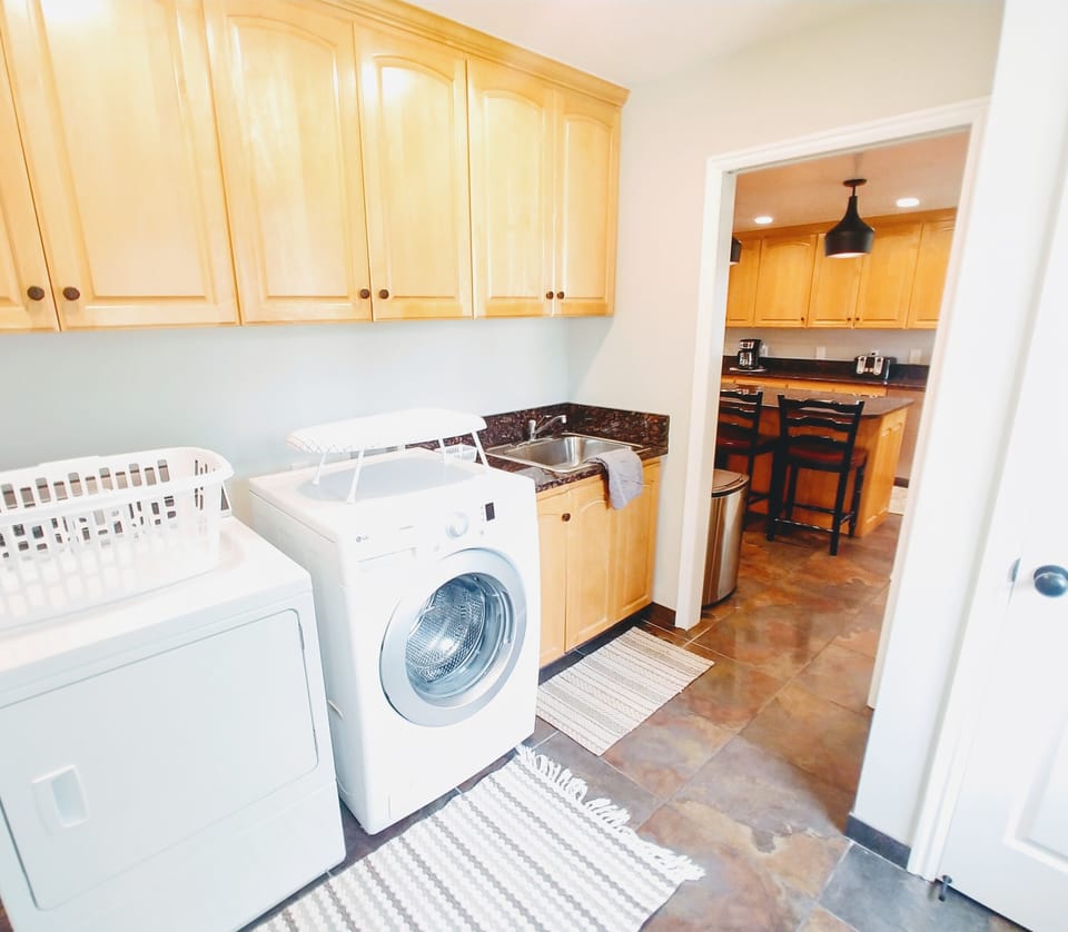 Main Floor Laundry Room and Mud Room with separate entrance off of the Kitchen 