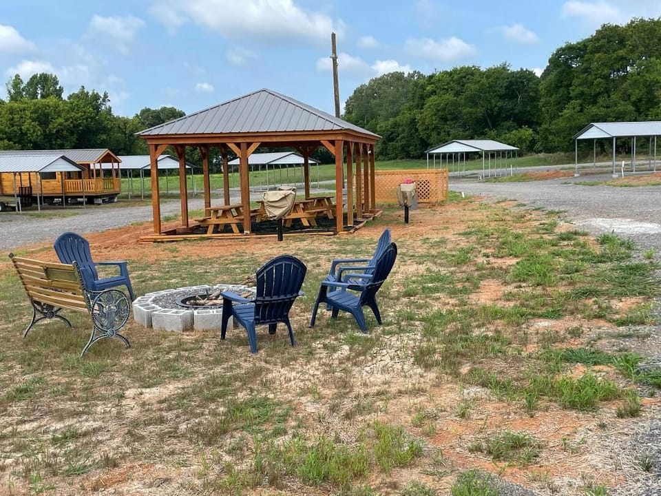Fire pit with pavilion in background